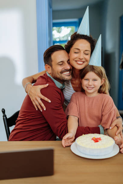istock Family hugging and smiling 2114497838