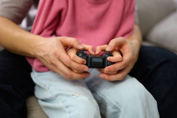 istock Father with girl playing video games 2114516597