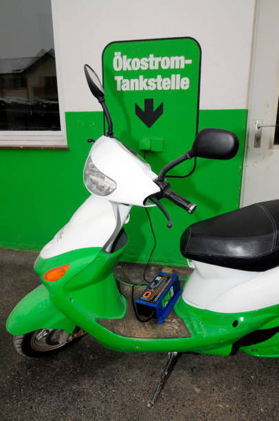 istock e-bike charging at a charging station 2114574284
