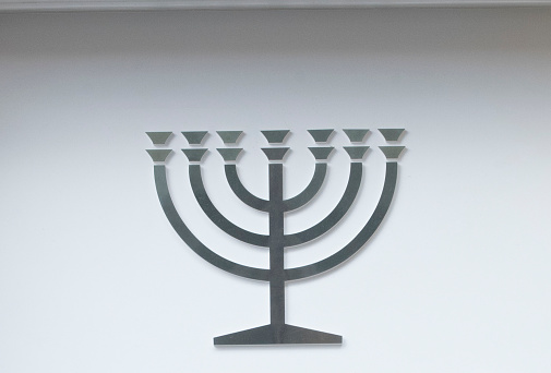 a hanukkah menorah or a hanukkiah, a nine branched candelabrum