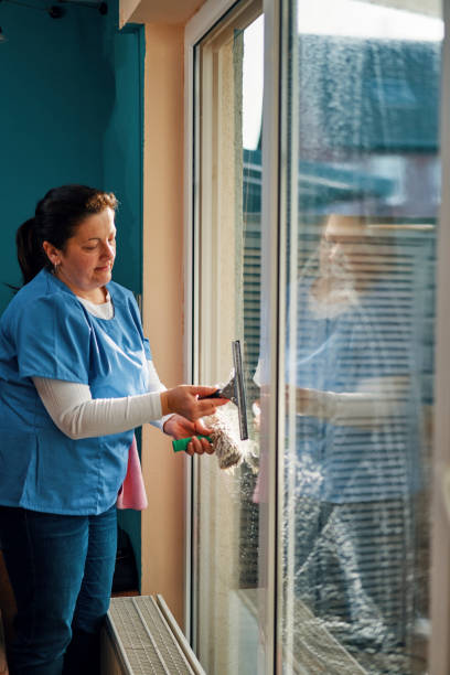 istock Domestic Cleaning Services -  Domestic Helper Cleaning Windows 2114603235