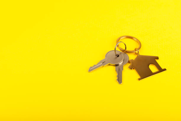 istock Plastic key ring in different colors with a place for a signature on a bright colored background. Bunch of keys with keychain. Mock-up keychain.Copy space.Concept for renting and selling real estate. 2114606859