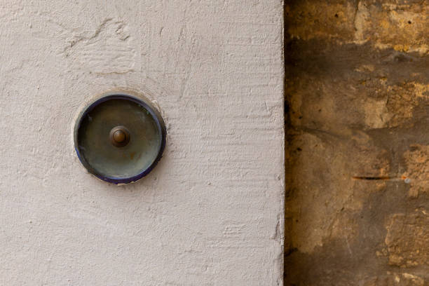 a old historic round doorbell on a wall