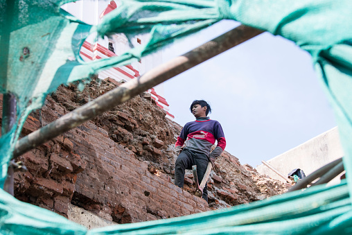 Kathmandu, Nepal- April 20,2022 : Local people of all ages and gender are working to rebuild the ruined old city in a major earthquake in Kathmandu.