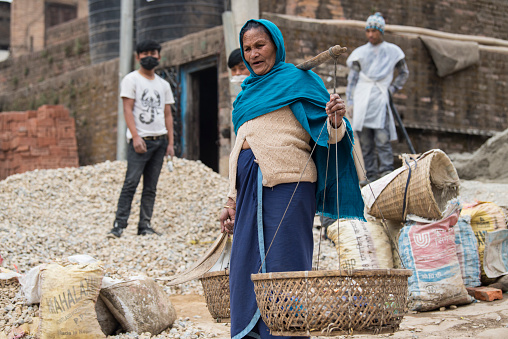 Kathmandu, Nepal- April 20,2022 : Local people of all ages and gender are working to rebuild the ruined old city in a major earthquake in Kathmandu.