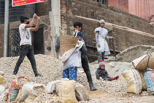 Kathmandu, Nepal- April 20,2022 : Local people of all ages and gender are working to rebuild the ruined old city in a major earthquake in Kathmandu.