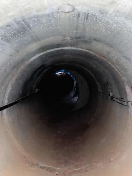 istock Dark gold mine tunnel. lit cave mine underground tunnel 2114635564