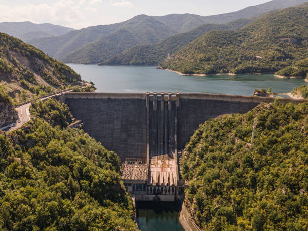 Aerial view of a closed dam wall in a mountain Hydroelectric power plant.
