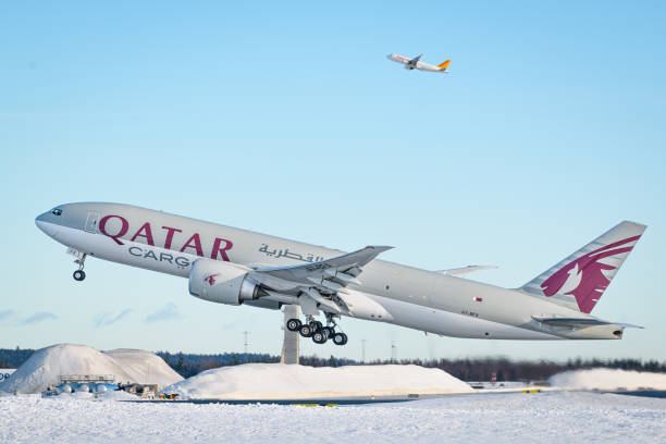 Qatar Airways Cargo Boeing 777F taking off from Oslo Airport, Gardermoen, aircraft reg A7-BFX