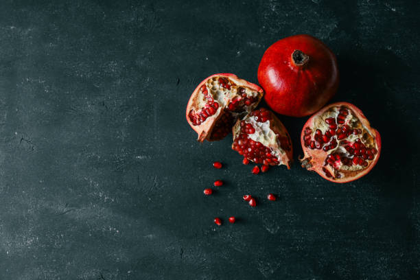 istock Pomegranate on Phantom Blue background. Top view, close up, background 2114676783