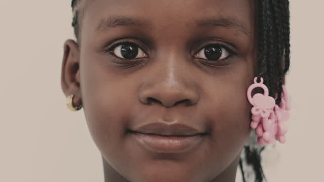 Smiling Black girl with earring
