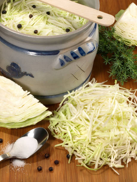 istock Vegetables - Making Fresh Sauerkraut on wooden Background 2114701729