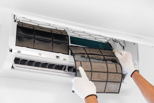 istock Remove the filter in the air conditioner for cleaning by a technician. A lot of dust gets stuck in the air filter. 2114709393