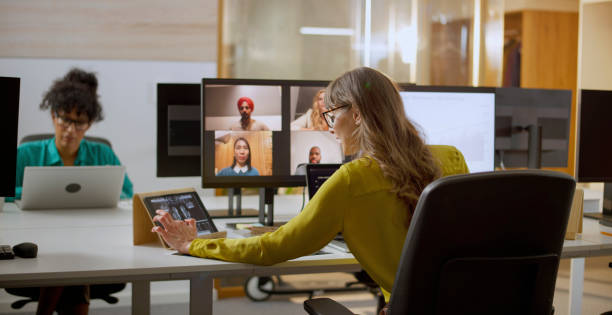 istock Woman having online meeting with team 2114723403