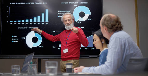 istock Businessman giving presentation with graph 2114723415