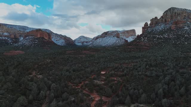 Stunning Red Sandstone Formations With Cloudy Sky In Sedona, Arizona, United States. Aerial Drone Shot