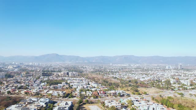 Islamabad with Margalla Hills and residential buildings cityscape aerial view