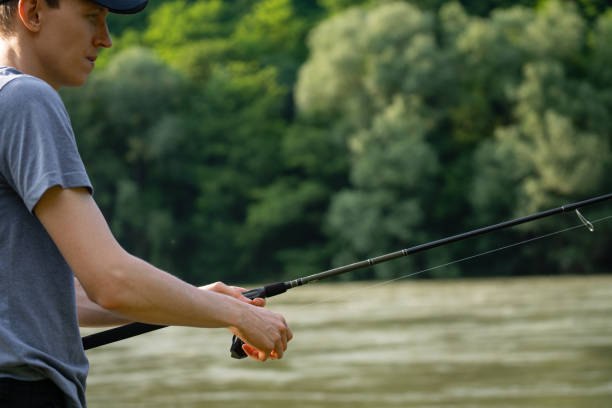 istock Man fishing on the mountain river 2114756958