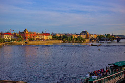 Prague, Czech Republic - October 6, 2023:  Panoramic views of the Vltava River and the city of Prague, the magical surroundings of Vysehrad. Romantic panorama of the city, red roofs, river.