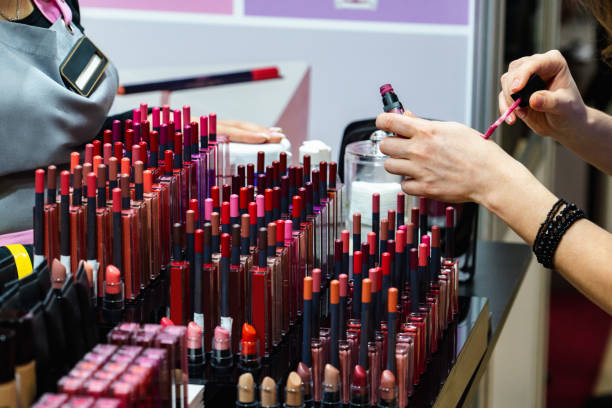 Woman chooses a lipstick in a cosmetics store