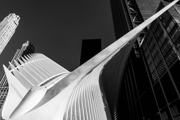 Wall Street, Manhattan, New York, USA - March, 2024. The Oculus building in Wall Street from outside the transport hub.Also known as The World Trade Center Transportation Hub. It is the Port Authority of New York and New Jersey's formal name for the new PATH station and the associated transit and retail complex that opened on March 3, 2016. It was designed by Spanish architect Santiago Calatrava and composed of a train station with a large and open mezzanine under the National September 11 Memorial plaza. This mezzanine is connected to an above ground structure called the Oculus—located between 2 World Trade Center and 3 World Trade Center—as well as to public concourses under the various towers in the World Trade Center complex.