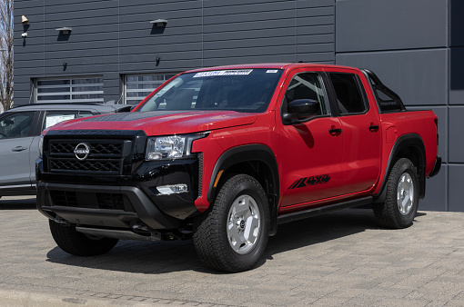Indianapolis - March 24, 2024: Nissan Frontier SV Crew Cab display. Nissan offers the Frontier in S, SV, PRO-X, PRO-4X, and Midnight Edition. MY:2024