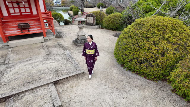 Woman in kimono walking in shrine - part 3 of 6
