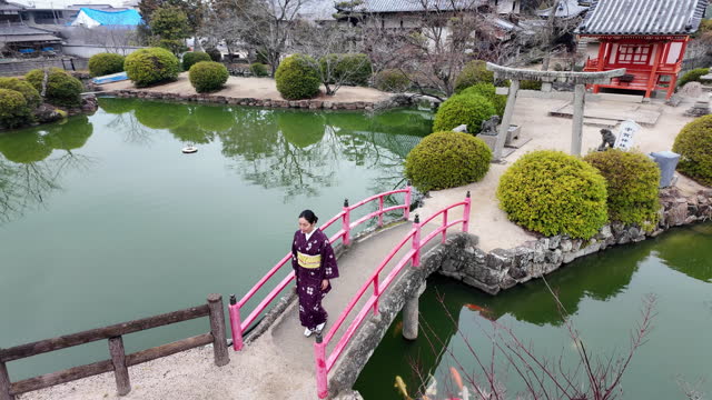 Woman in kimono walking in shrine - part 6 of 6