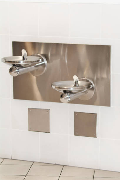 istock Modern drinking fountains on white wall 2114851032