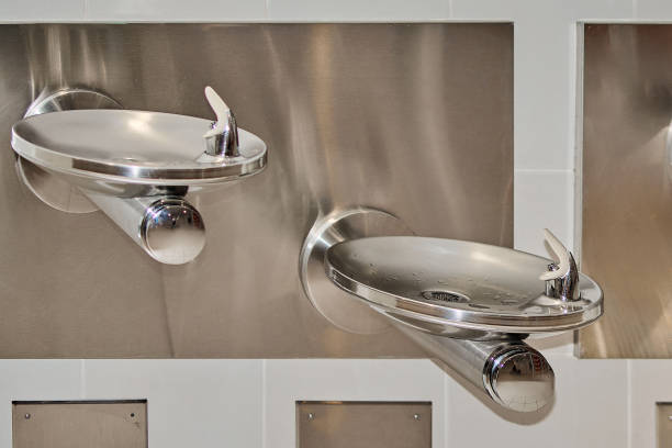 Stainless steel water fountain on the wall
