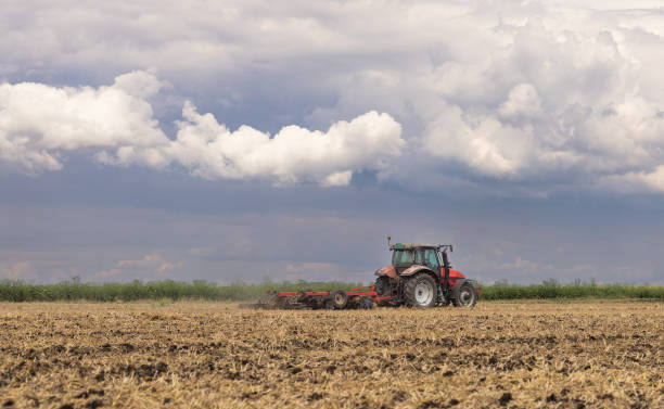 istock Tractor preparing land with seedbed cultivator. 2114857040