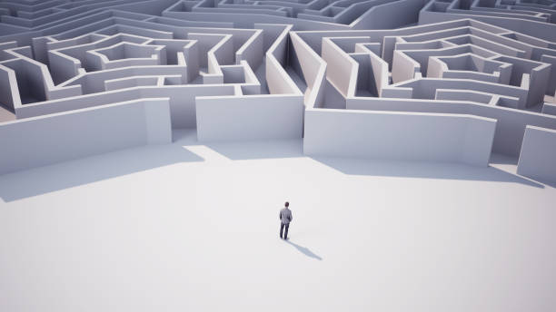 istock Businessman Going Towards Star Shaped Maze 2114878261