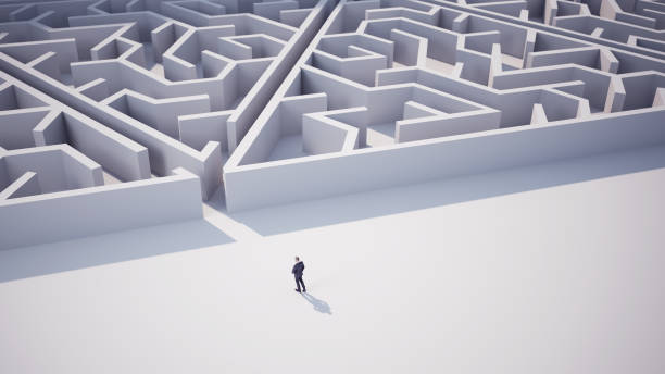 istock Businessman Going Towards Triangle Shaped Maze 2114879300