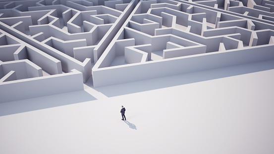 3d Render Businessman heading towards triangle shaped maze. Business and Finance Concept (Depth of Field)