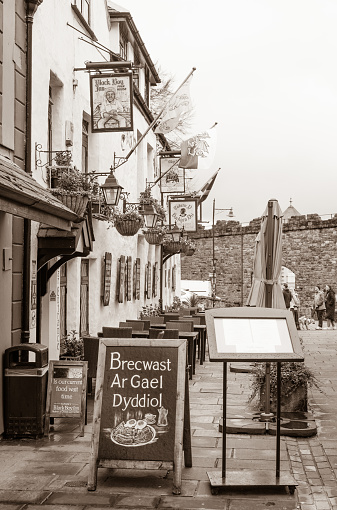 Looking along Stryd Pedwar a Chwech in the town of Caernarfon in the county of Gwynedd in North Wales, UK.