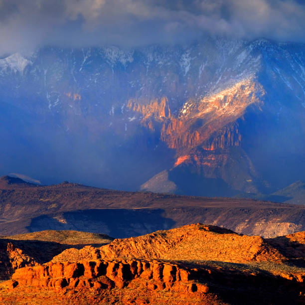 istock Red Cliffs Landscape Mountains Storm Clouds and Snow 2114906915