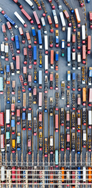 istock Aerial View of Trucks Entering Container Terminal 2114910567