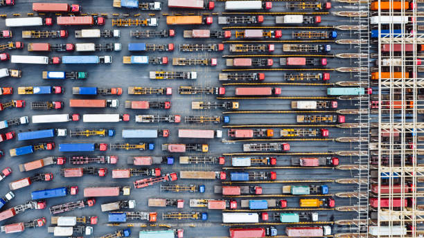 istock Aerial View of Trucks Entering Container Terminal 2114910573
