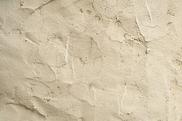 istock Rough gray plaster, unfinished wall. Textured wall background 2114928664