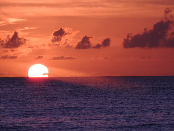 istock Sunset in the Cayman Islands by the Ocean 2114932360