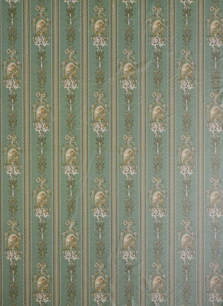 istock Old wallpaper on the wall. Old wallpaper for texture or background. 2114933429