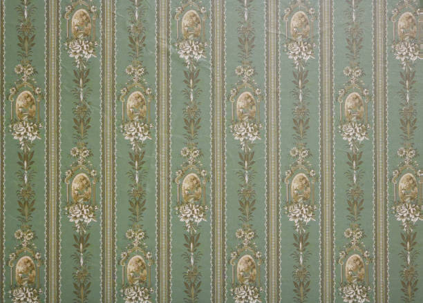 istock Old wallpaper on the wall. Old wallpaper for texture or background. 2114935951