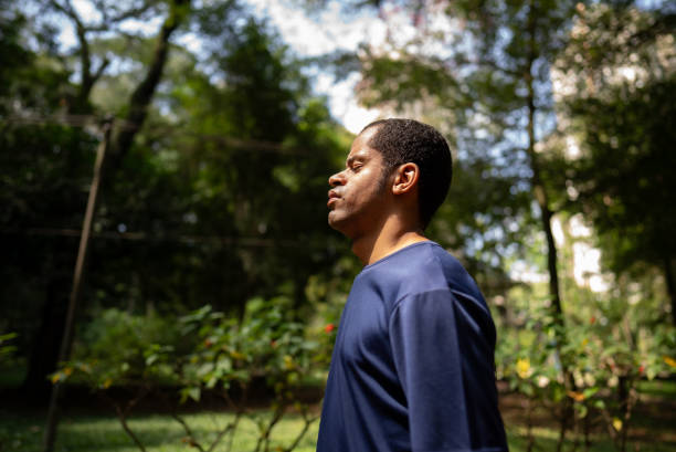 istock Visually impaired man on a breathing exercise at a public park 2114952831