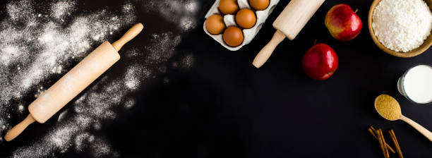 istock Ingredients for making apple pie or cake on the black background. Copy space. Top view. 2114978823