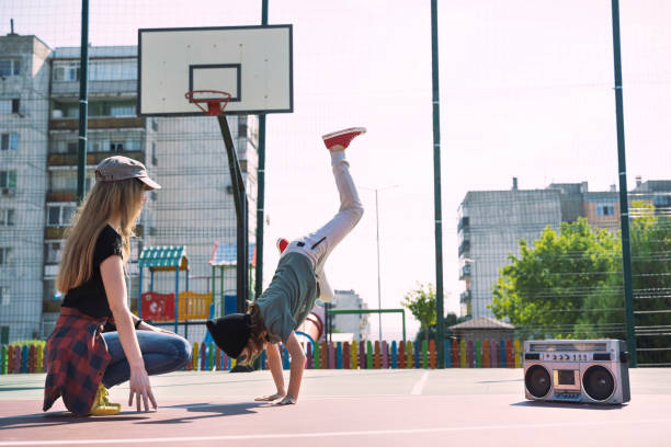 istock Mother and son listening music, having fun and practicing breakdance 2114981694