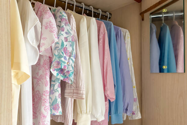 istock Spring/summer pastel colored clothes on hangers 2114982210