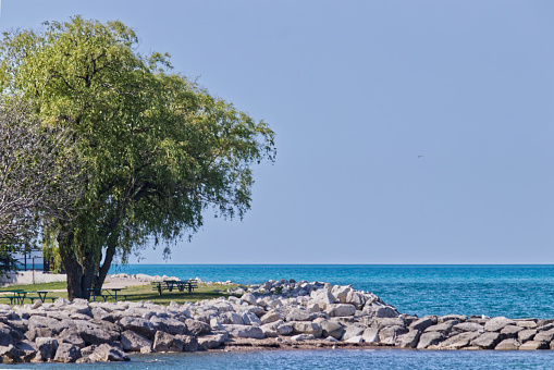 Nice summer day to enjoy the lake from the shades of the trees on the beach - Goderich, ON, Canada