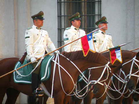 Uniformed cavalrymen changing the Guard in front of the Moneda Palace, Santiago Metropolitan Region, Chile