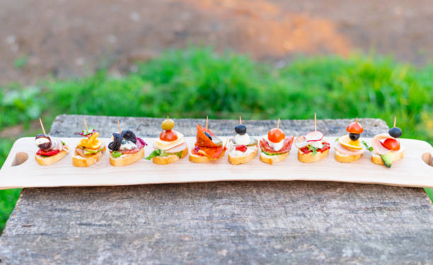 istock Finger food , various canapes with vegetables, ham, bacon , cheese and olives. 2114998029