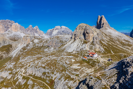 Dolomites, Dolomiti Alps in Italy beautiful mountain summer landscape with high rocky towers on the hiking route trekking around Tre Cime di Lavaredo